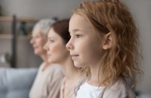 A side shot of three generations of females
