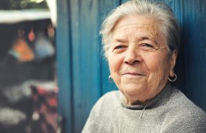 Happy old woman smiling outdoors